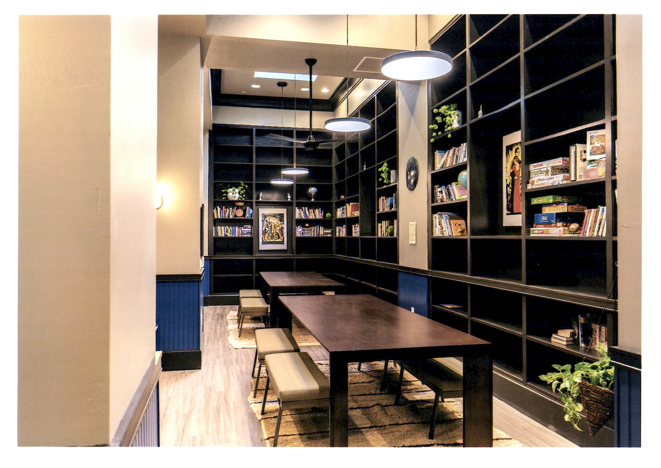 After: another view of the lounge area showing bookshelves.